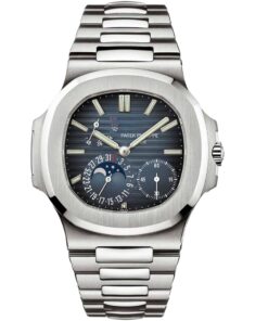 A close-up of the Patek Philippe Nautilus watch face, showing its iconic blue dial with a horizontal embossed pattern, luminescent hands and markers, and a moon phase indicator surrounded by a date sub-dial.