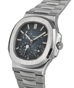 A side profile of the watch featuring the brushed and polished stainless steel case, the fluted crown, and the elegant sweep of the integrated bracelet, showcasing its sophisticated construction.