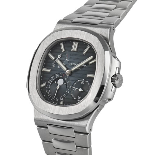 A side profile of the watch featuring the brushed and polished stainless steel case, the fluted crown, and the elegant sweep of the integrated bracelet, showcasing its sophisticated construction.