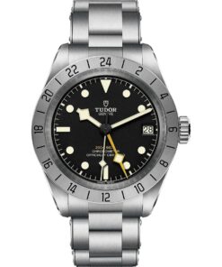 A front view of the Tudor Black Bay Pro watch on a stainless steel bracelet. It features a black dial with luminescent markers, a prominent yellow 24-hour hand, and a fixed stainless steel bezel with a 24-hour scale.