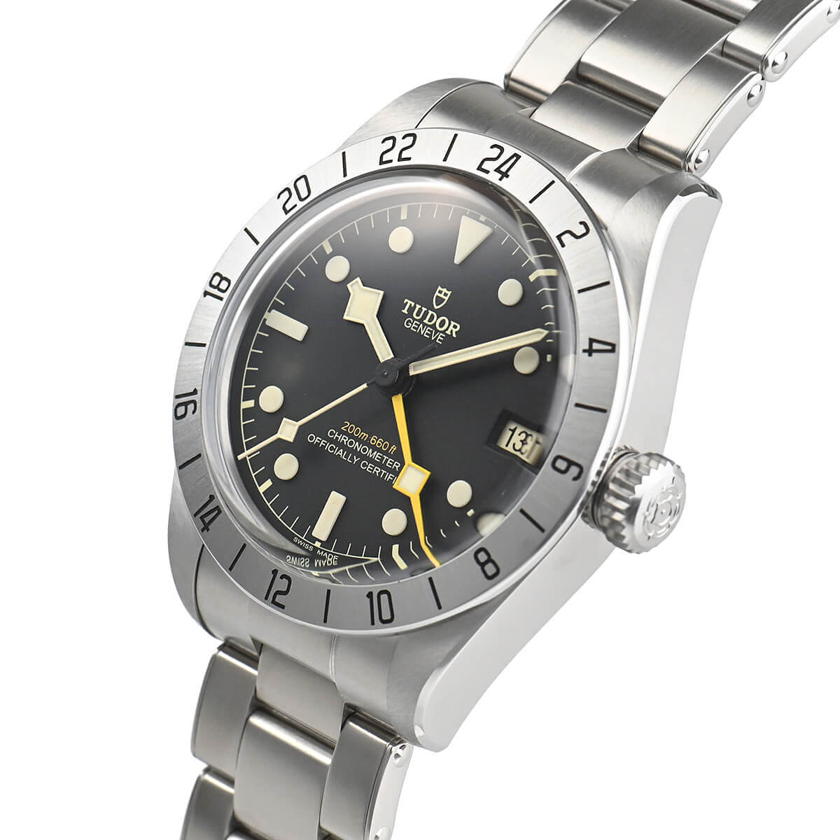 A close-up profile view of the watch's right side, highlighting the satin-brushed case and the prominent screw-down crown with a black anodized aluminum tube, ensuring 200-meter water resistance.