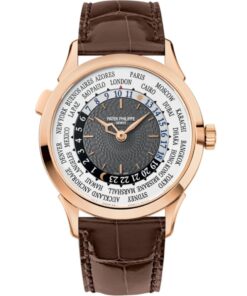 A close-up of the Patek Philippe 5230R-001's charcoal-gray dial, showcasing its hand-guilloché center, rose gold applied markers, and the concentric world time display with a city ring and 24-hour track.