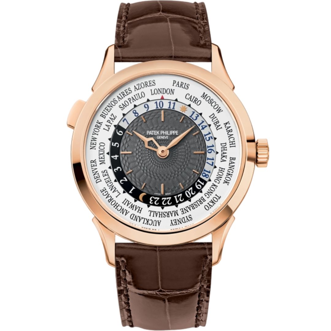 A close-up of the Patek Philippe 5230R-001's charcoal-gray dial, showcasing its hand-guilloché center, rose gold applied markers, and the concentric world time display with a city ring and 24-hour track.
