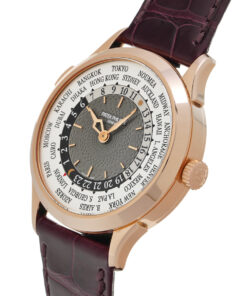 A side profile of the watch, showing the slender, polished rose gold case and the fluted crown, presented on a rich brown alligator strap.