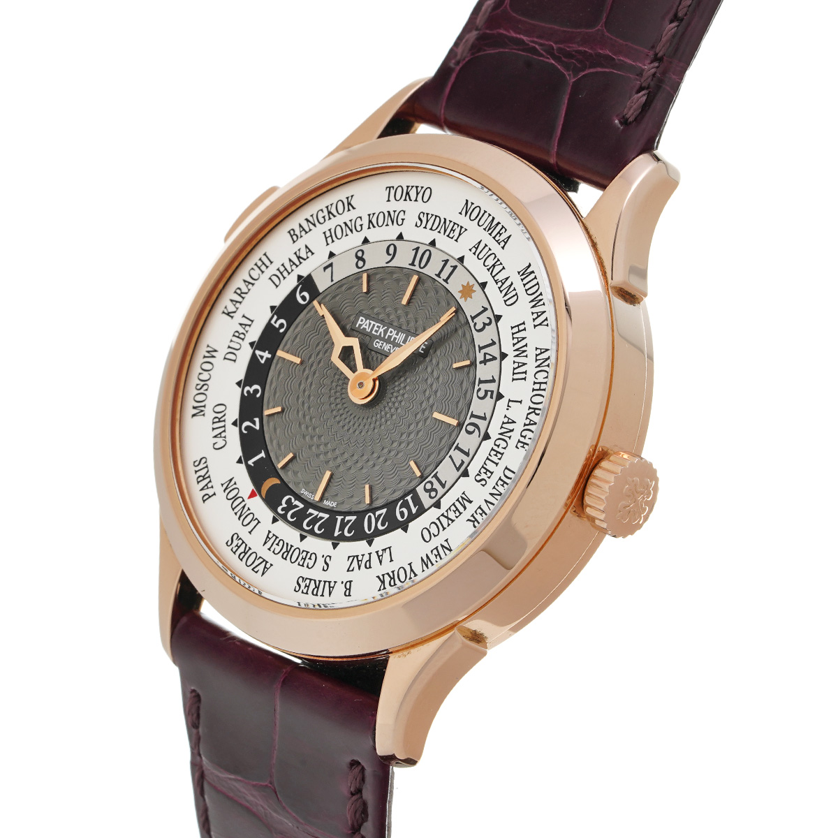 A side profile of the watch, showing the slender, polished rose gold case and the fluted crown, presented on a rich brown alligator strap.