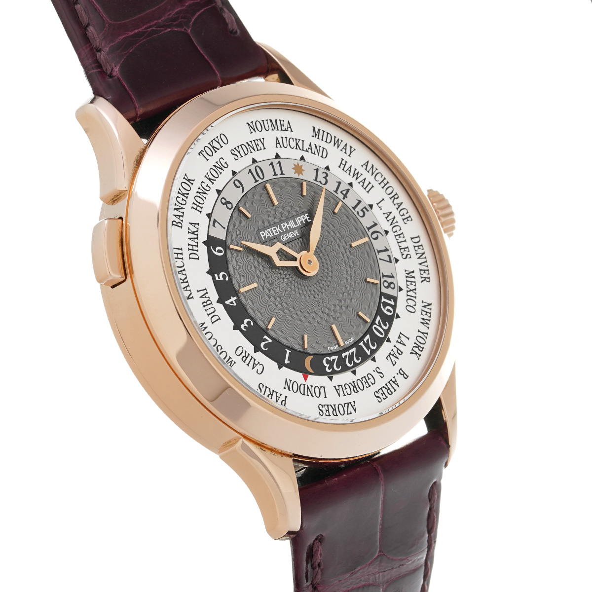 A profile view of the watch's polished rose gold case, highlighting the single, streamlined corrector pusher at 10 o'clock used to adjust the world time complication.