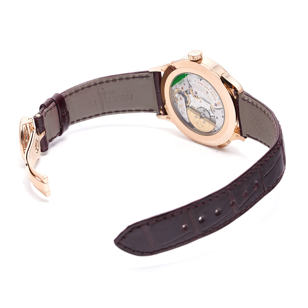 The sealed case back of the rose gold watch, simply and elegantly engraved with the Patek Philippe Calatrava cross and the words "Patek Philippe Geneve."